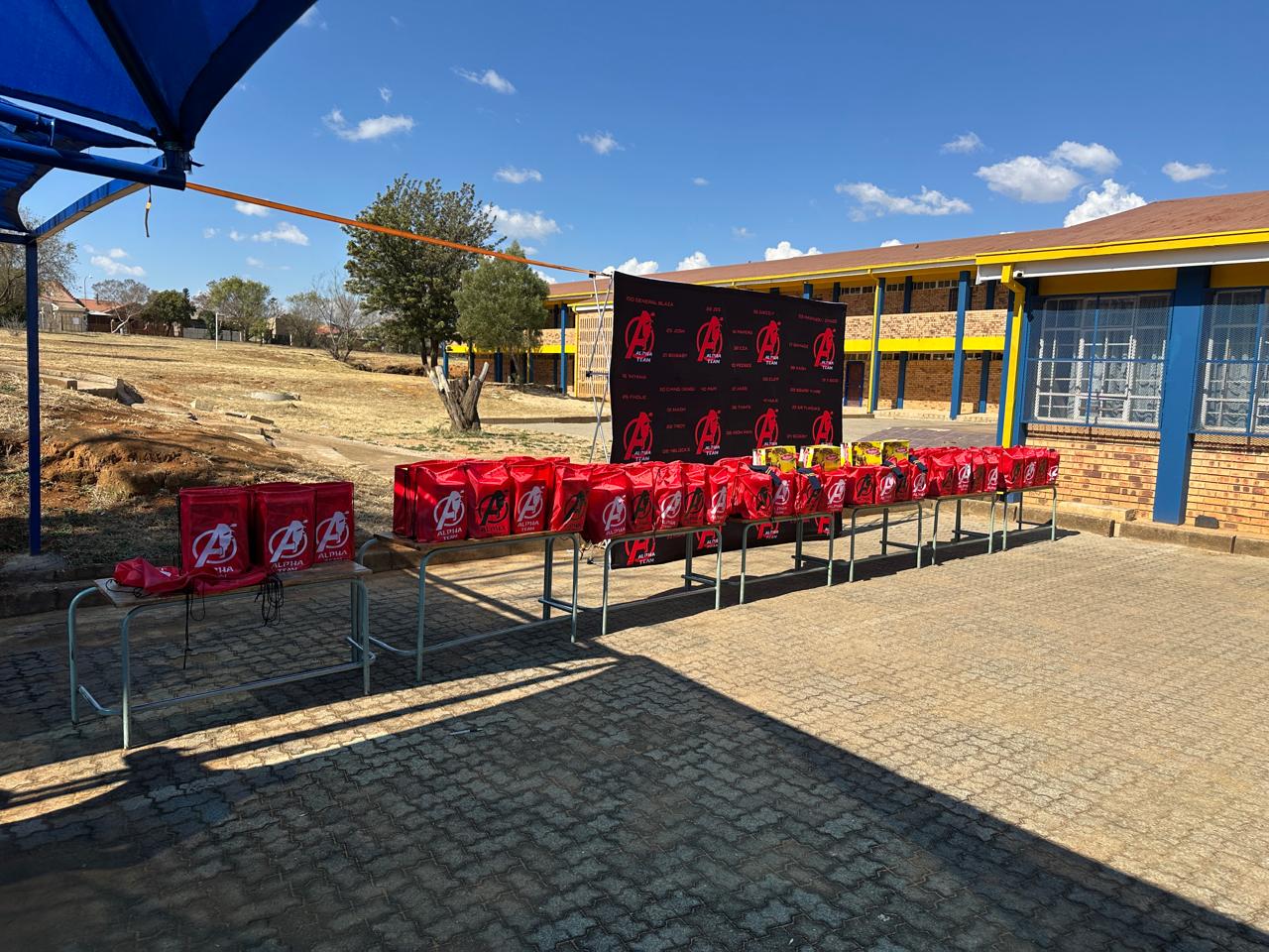 Branded packs laid out before hand-over